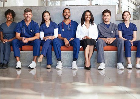 Healthcare workers sitting in a hospital