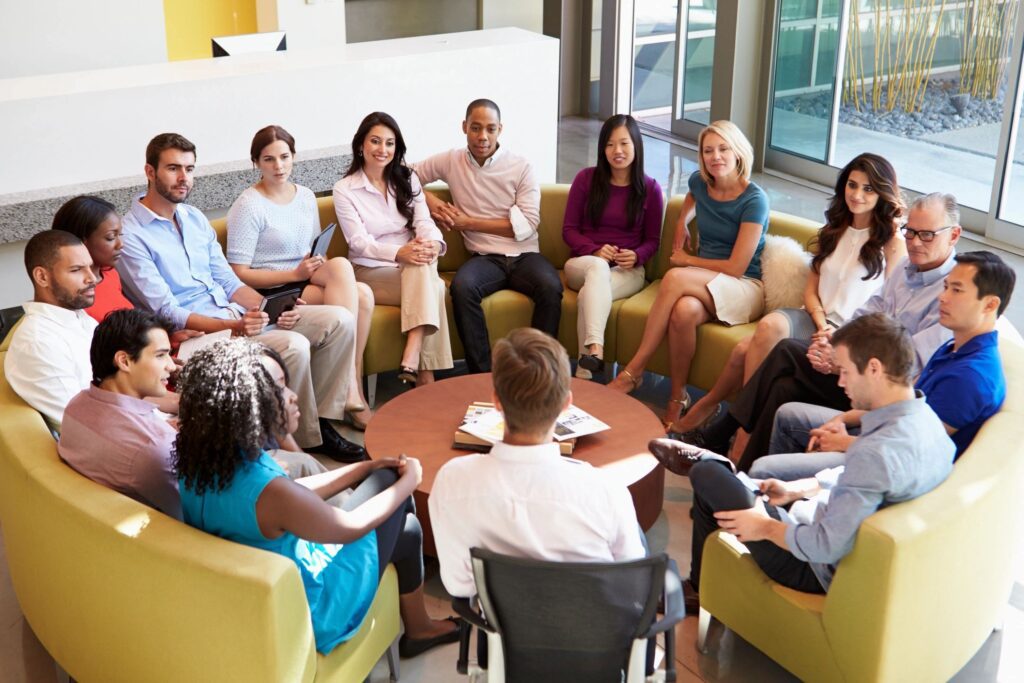 A Group Sitting on a Circular Couch