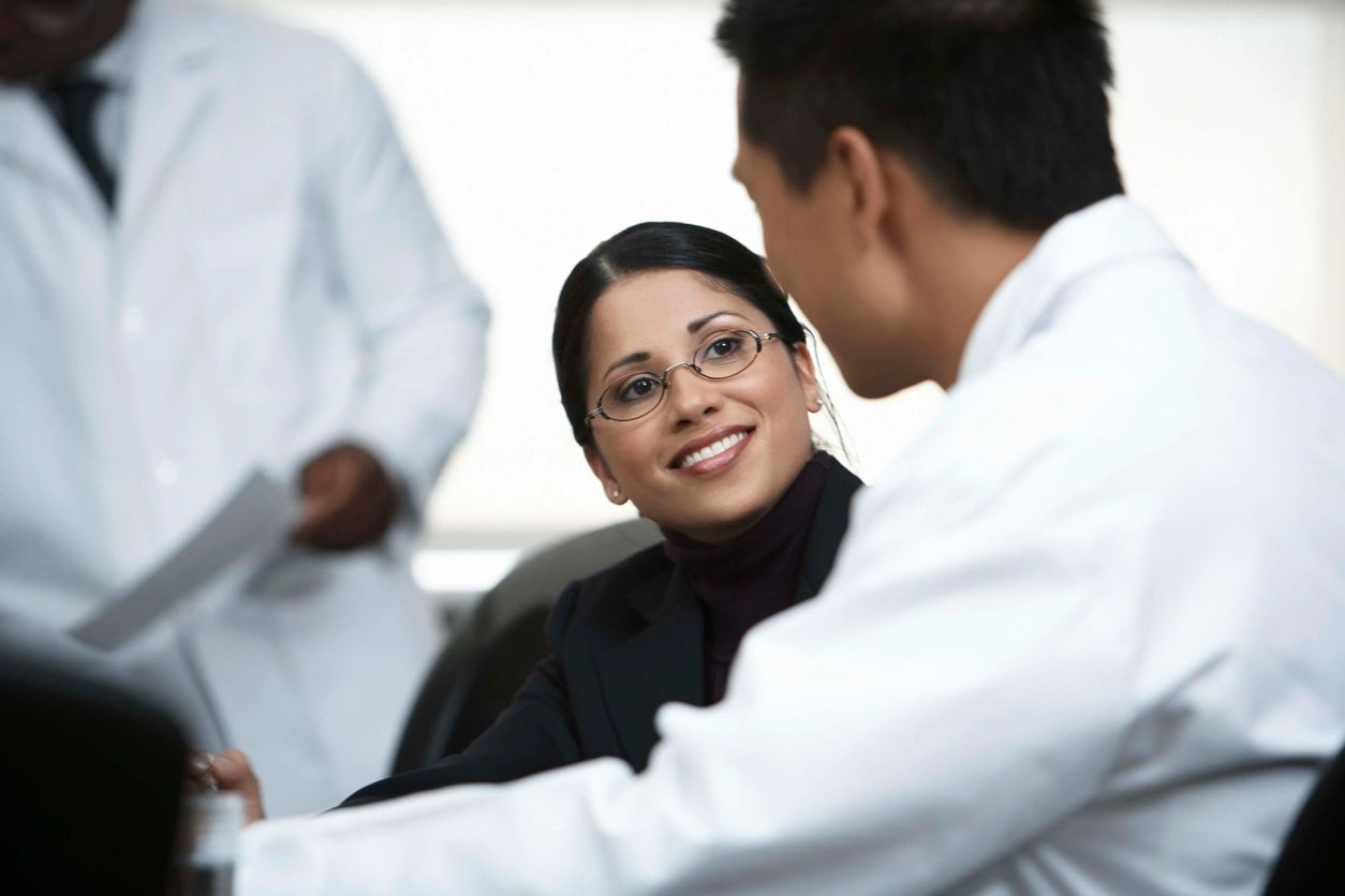 Women looking at the doctor and smiling